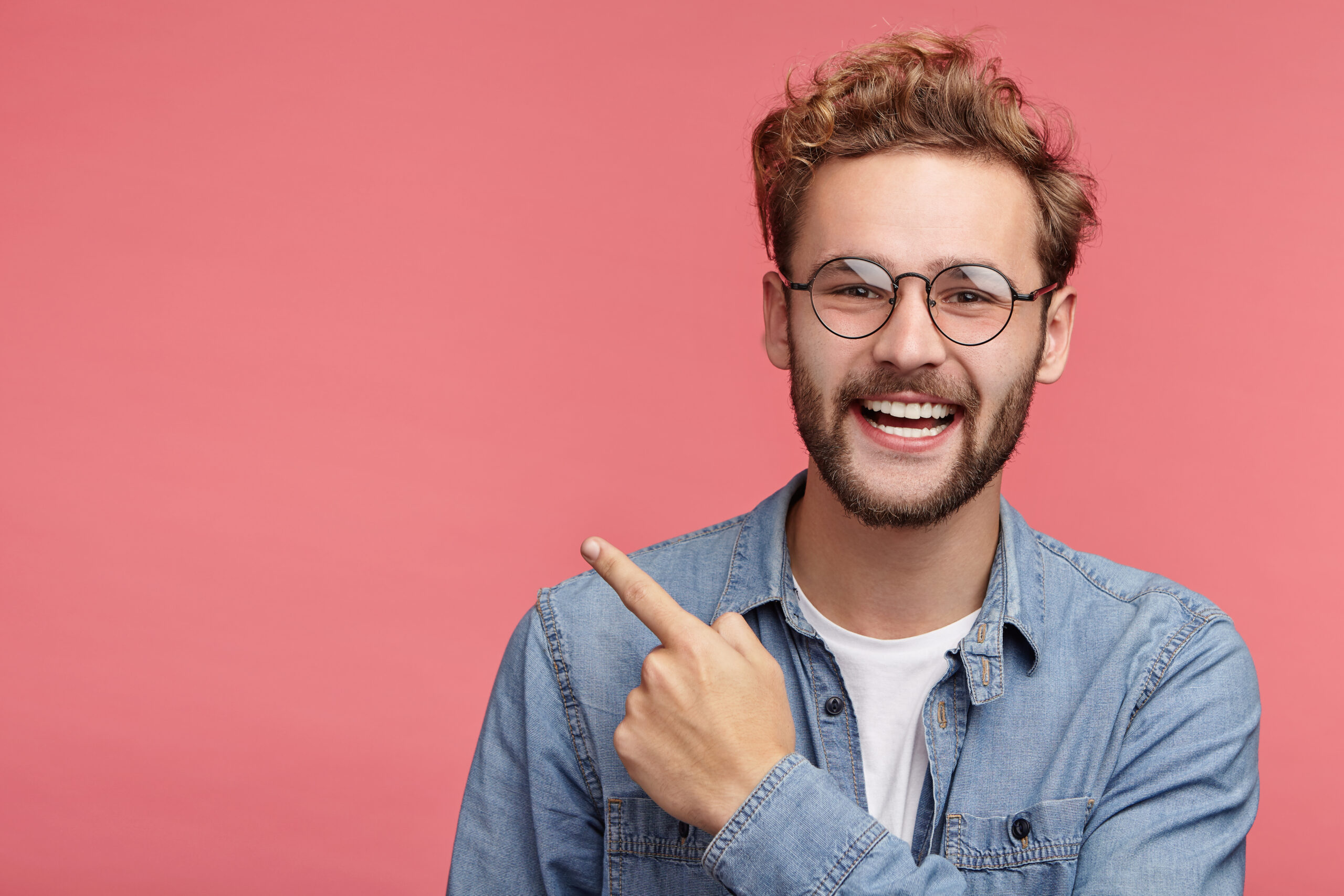 indoor portrait bearded young man with trendy hairstyle scaled